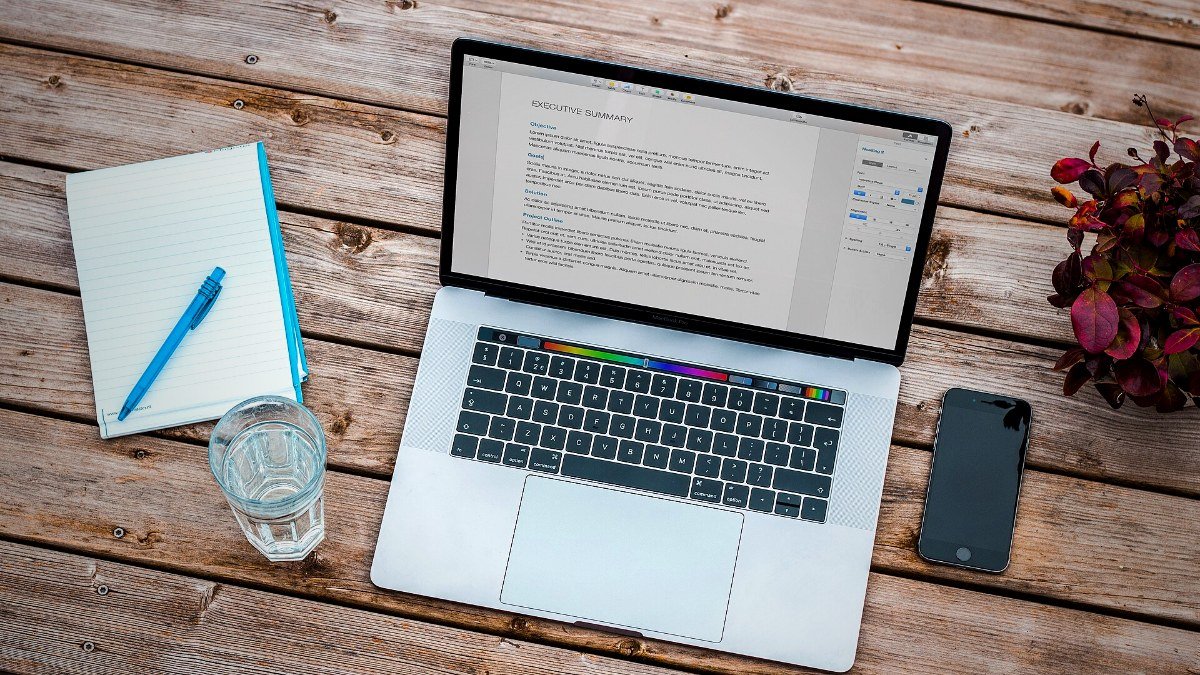 MacBook Pro laptop on a wooden desk