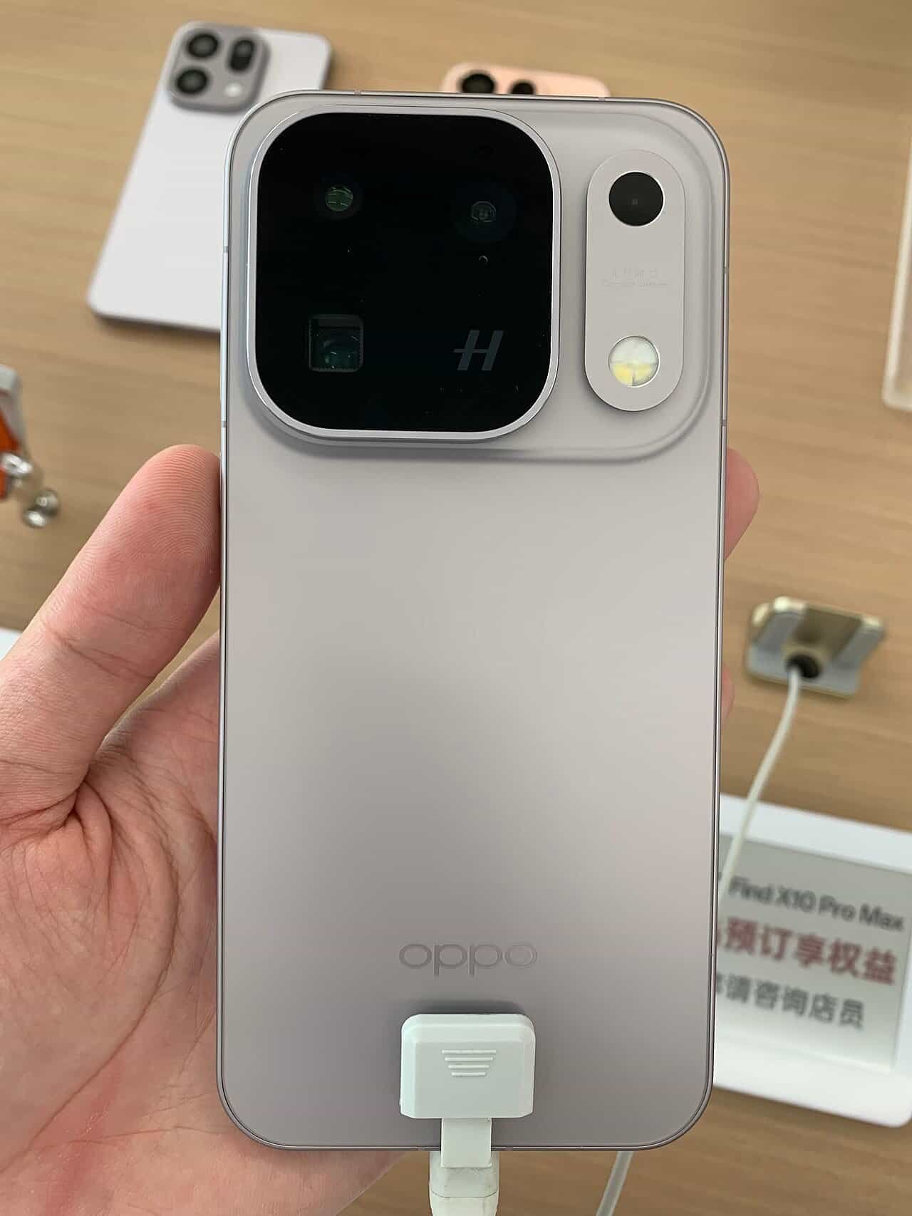 OPPO Find X10 Pro Max in Titanium Grey showing its square triple 200MP Hasselblad camera module
