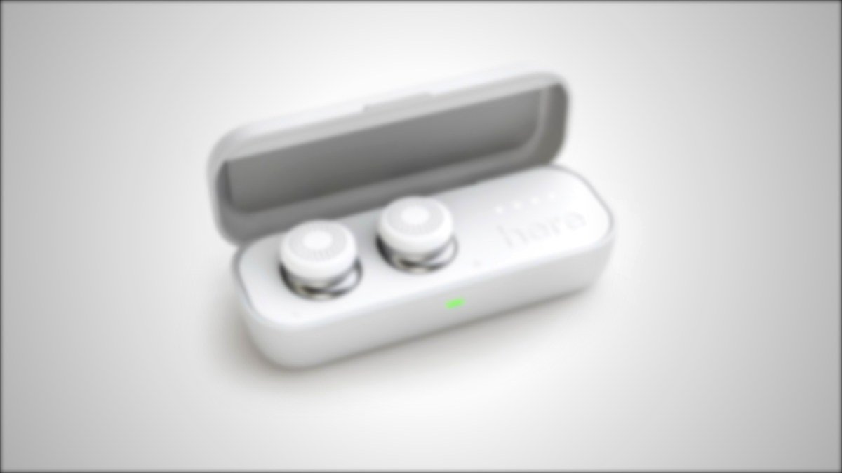 Wireless earbuds in a white charging case